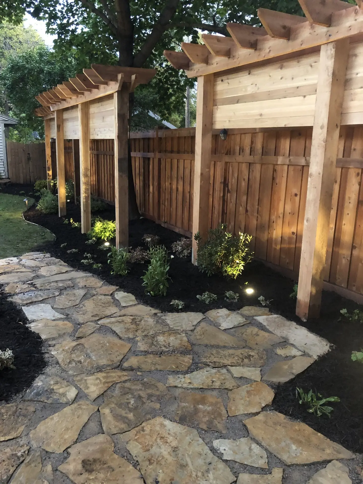 A custom trellis-style privacy wall, ideal for supporting climbing plants, creating a natural and beautiful outdoor divider.