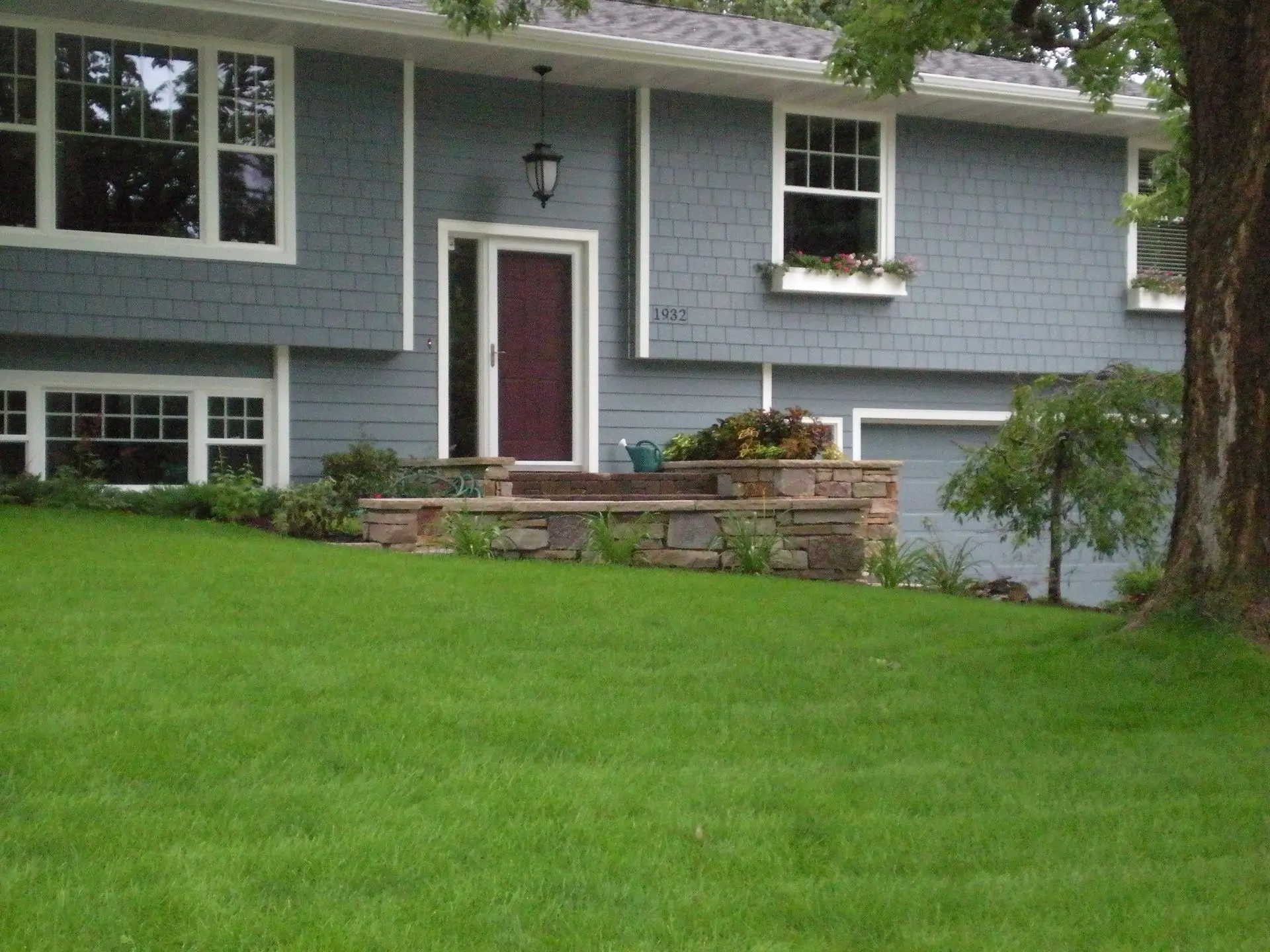 A residential lawn showcasing a smooth, evenly laid sod installation for a pristine and healthy yard.