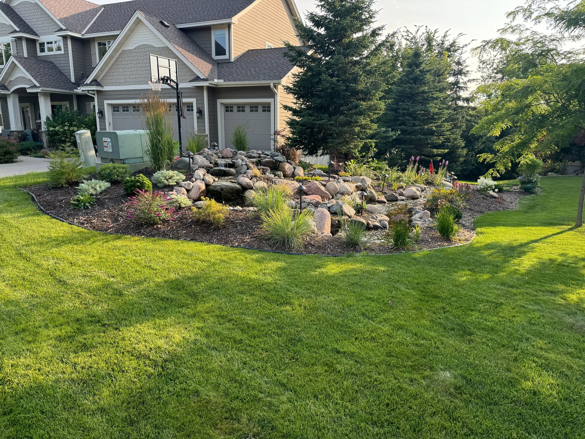 A newly laid sod lawn with rich green grass, offering an instant transformation for the outdoor space.